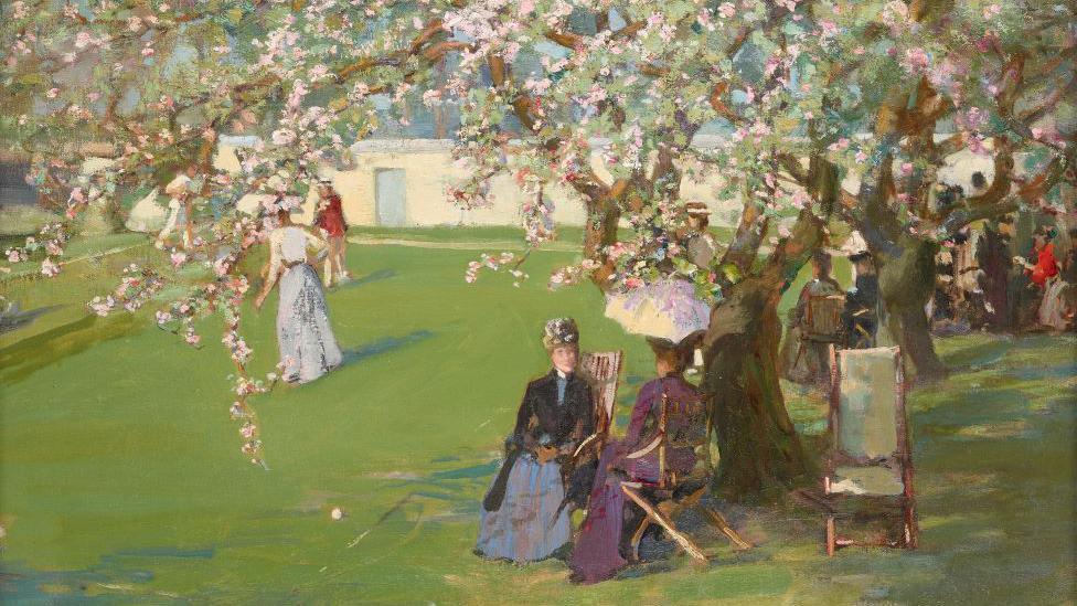 Sir John Lavery’s Paisley Lawn Tennis Club shows late 19th century socialites sitting under a cherry blossom tree and figures play lawn tennis in the background