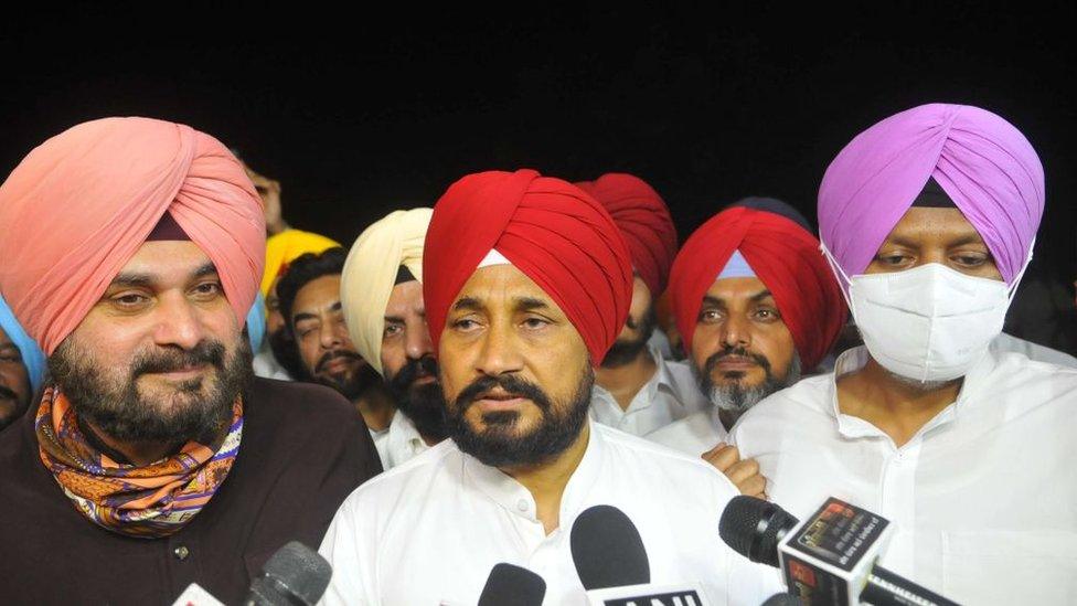 Punjab chief minister Charanjit Singh Channi (C) interacts with the media outside Punjab Raj Bhawan, on September 19, 2021 in Chandigarh, India.