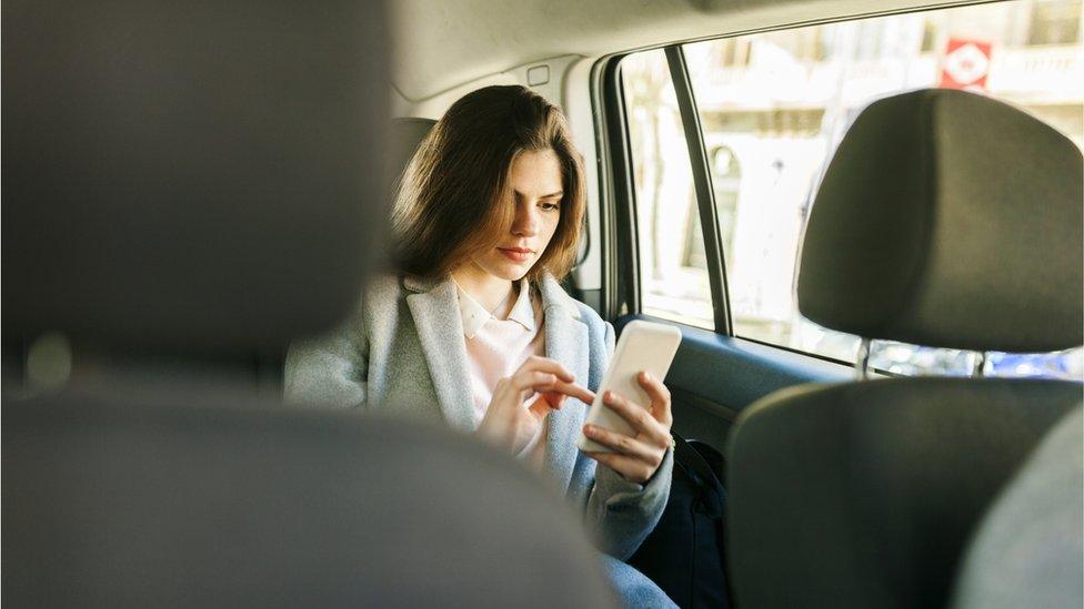 woman in taxi