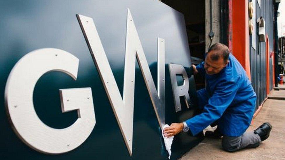 Man polishing GWR train