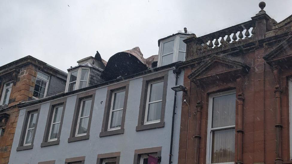Damage to a roof during storm.