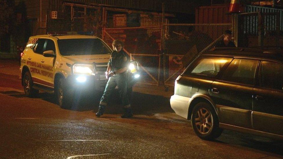 Ambulance vehicles and officers outside a workshop in Woolner, where it is believed a gunman has shot multiple victims, in Darwin, Northern Territory, Australia, on 4 June 2019