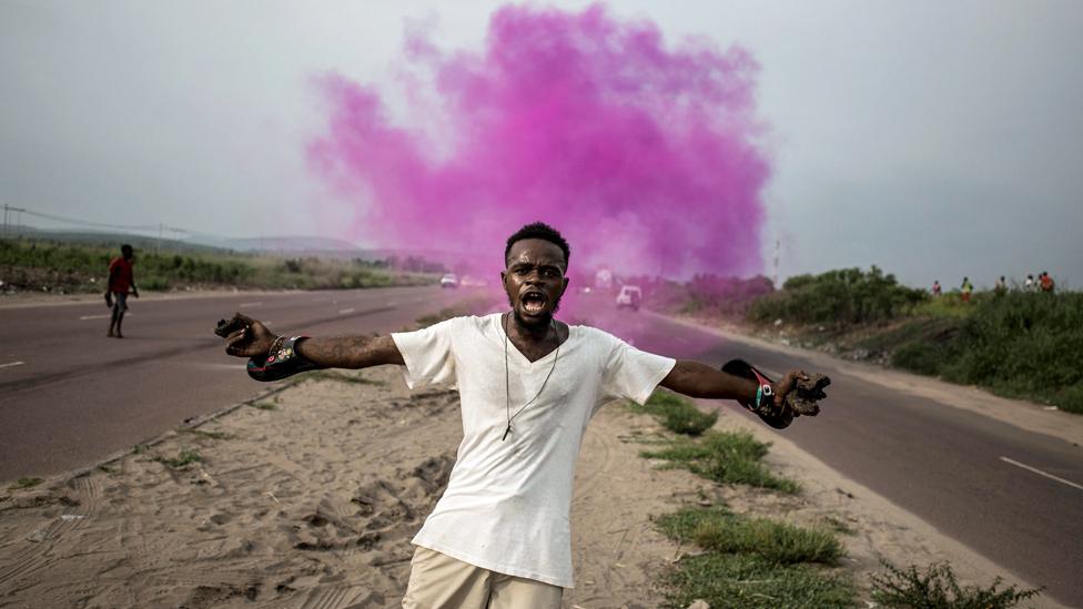 A supporter of Democratic Republic of Congo opposition leader Martin Fayulu reacts after police fire teargas in Kinshasa, DR Congo - 19 December 2018