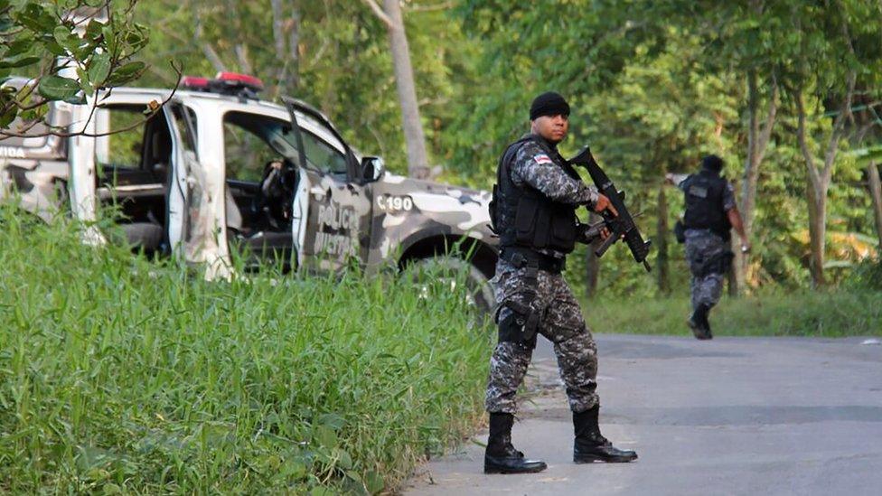 Military police officers track for fugitives of the Anisio Jobim Penitentiary Complex after a riot in the prison left at least 60 people killed and several injured, in Manaus, Amazonia state, Brazil on January 2, 2017