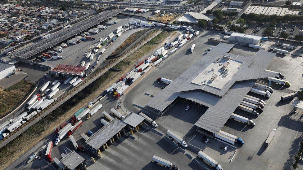 An aerial view of trucks queuing to cross from Mexico into California at the Otay Mesa port of entry on May 11, 2017 in San Diego, California