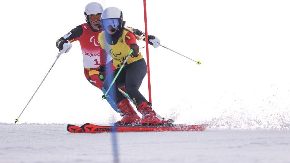 Linda Le Bon and her daughter Ulla skiing down a slope.
