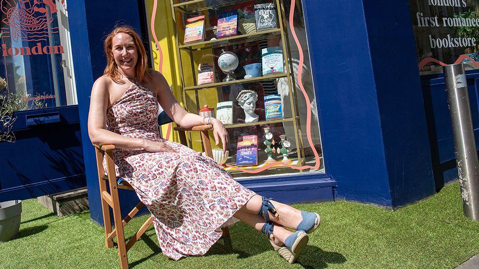Sarah, owner of Saucy Books, a romance genre bookshop in west London