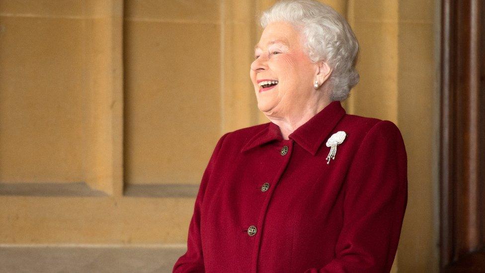 The queen laughing