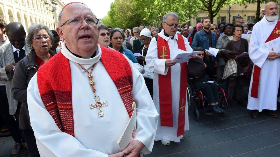 Archbishop of Bordeaux Jean-Pierre Ricard (L) celebrates the Passion of Christ on Good Friday in Bordeaux, southwestern France, on April 14, 2017