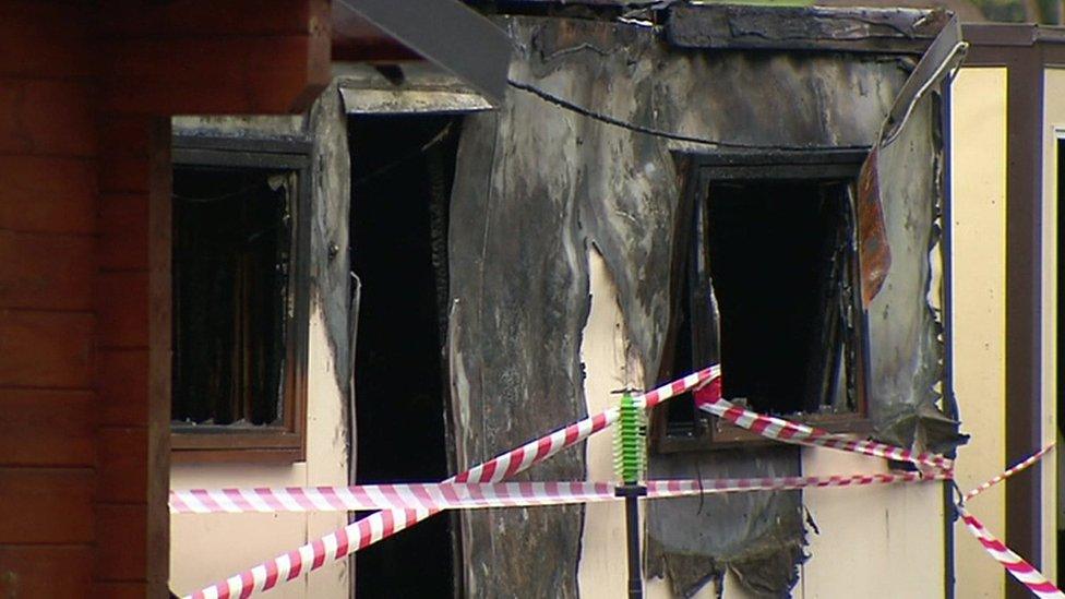 The burnt remains of one of the buildings destroyed by the fire