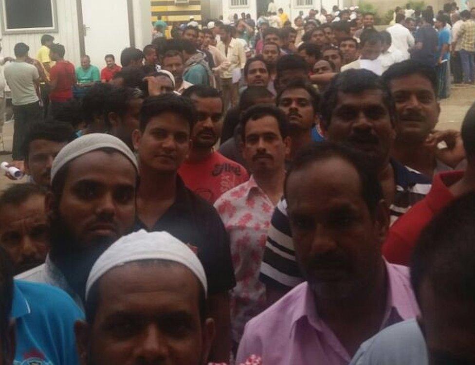 Indian men seeing queuing for food in Jeddah - 31 July 2016