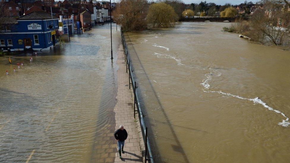 The flooded Smithfield Road in Shrewsbury (left) and the River Severn (right),