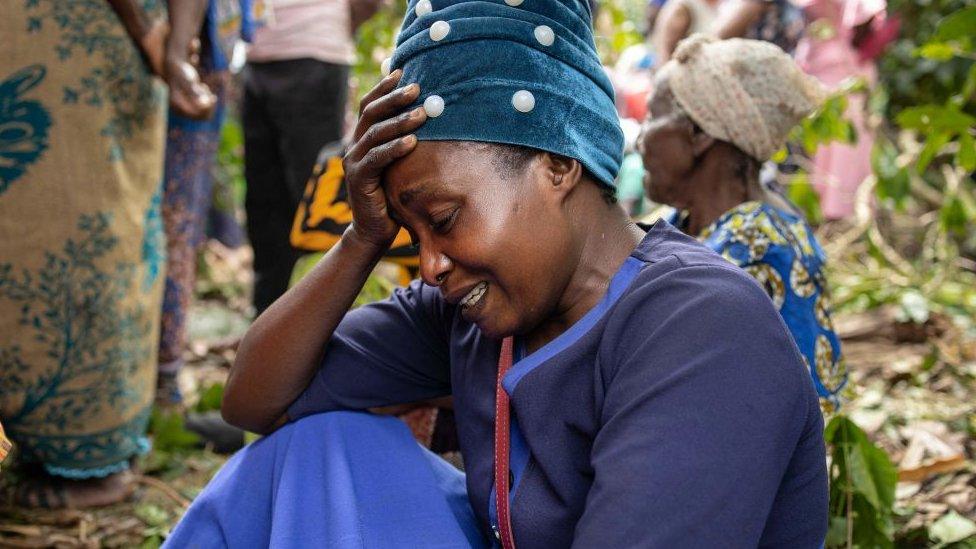 A mourner at a funeral in Mpondwe, Uganda - 18 June 2023