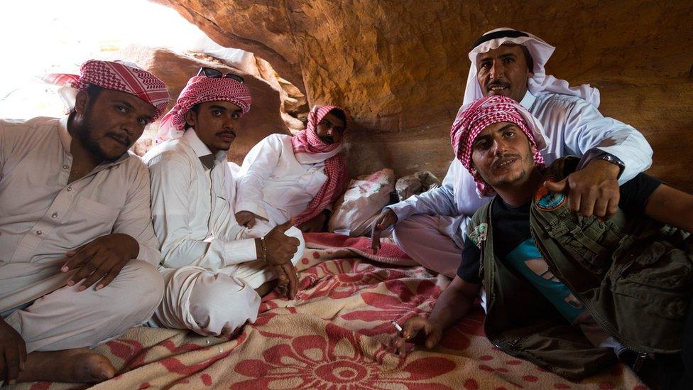 Tribesmen of the Muzeina and Alegat tribes sit in a cave