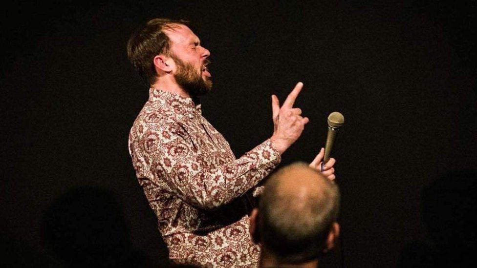 Alex Hylton on stage at the Edinburgh Festival Fringe