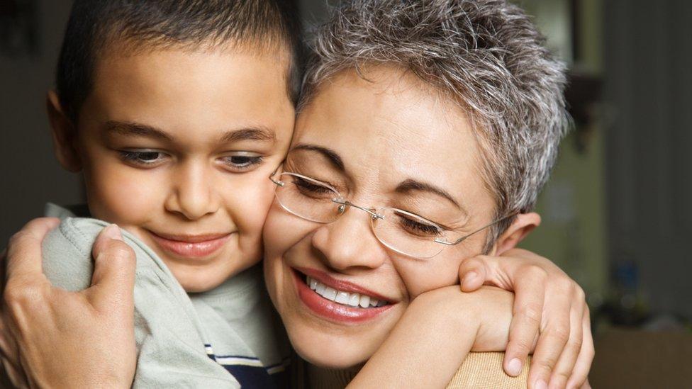 Woman and child hugging