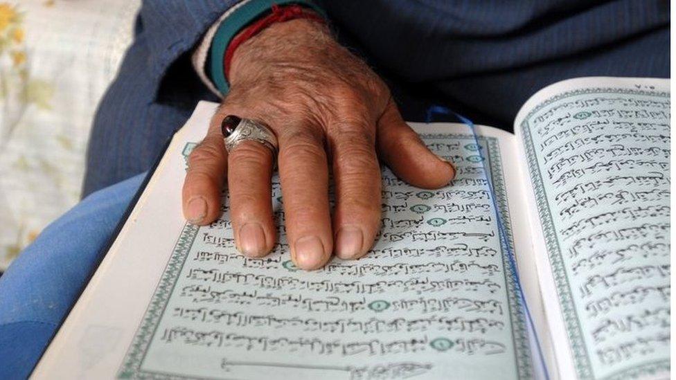 Man with Koran