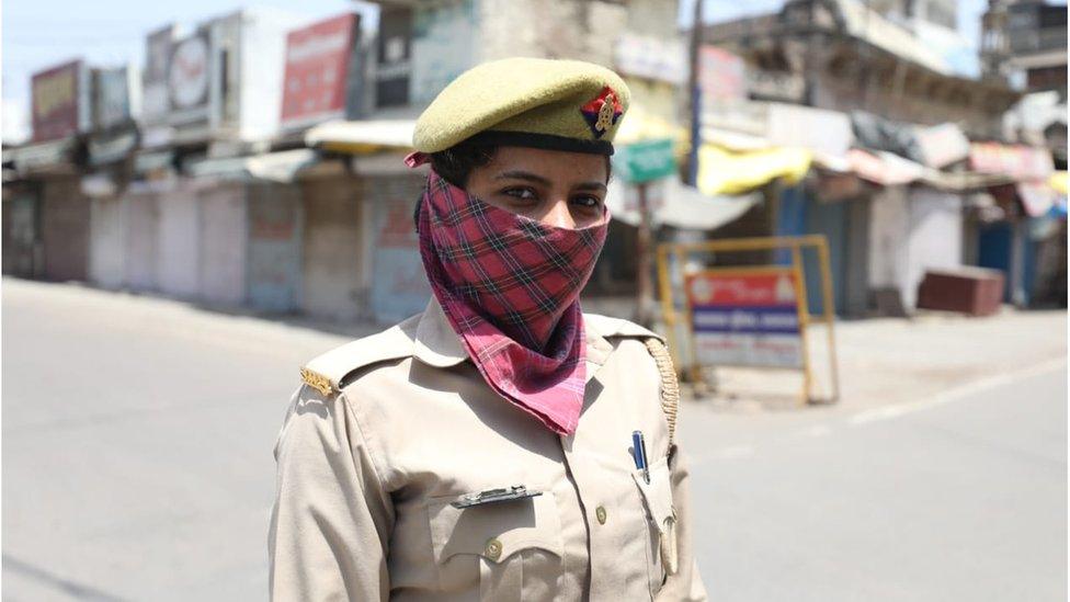 A police officer in an empty street