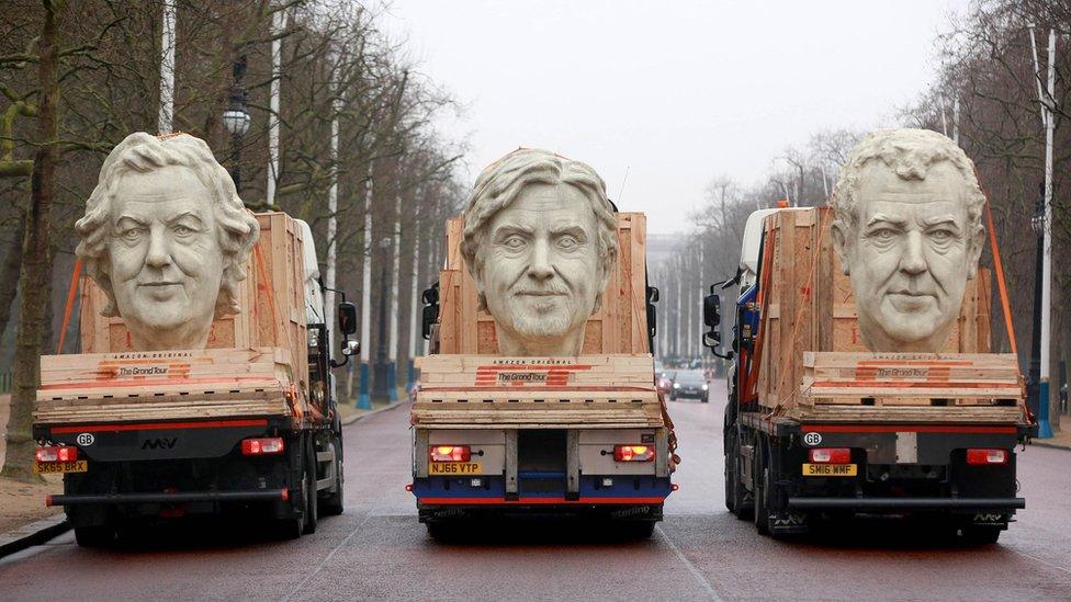 Three giant heads of James May, Richard Hammond and Jeremy Clarkson - part of a Grand Tour Stunt