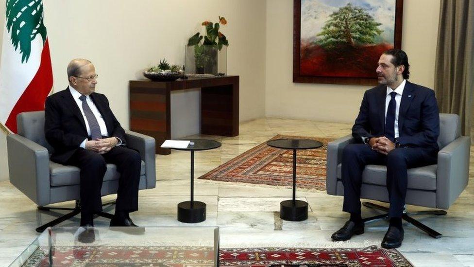 Lebanese President Michel Aoun (L) speaks to former Prime Minister Saad Hariri (R) at the Baabda Palace (12 October 2020)