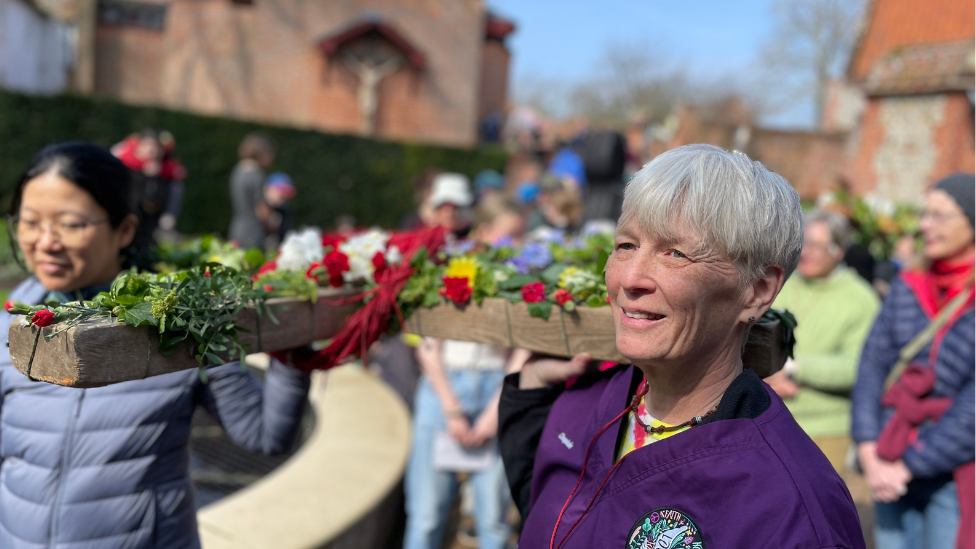 Two women carrying a cross on last year's pilgrimage