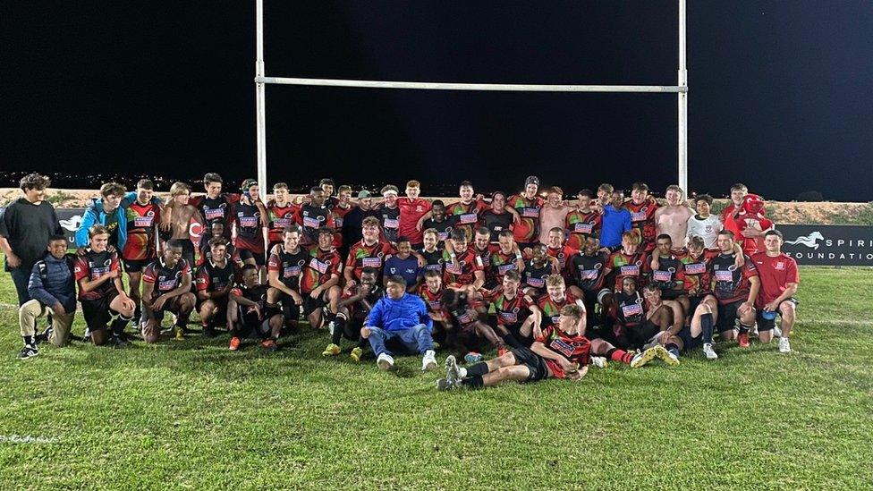 Boys playing rugby