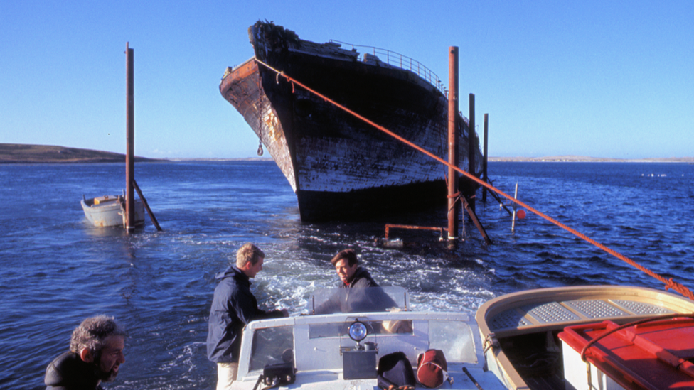 1970 image of the ship being towed