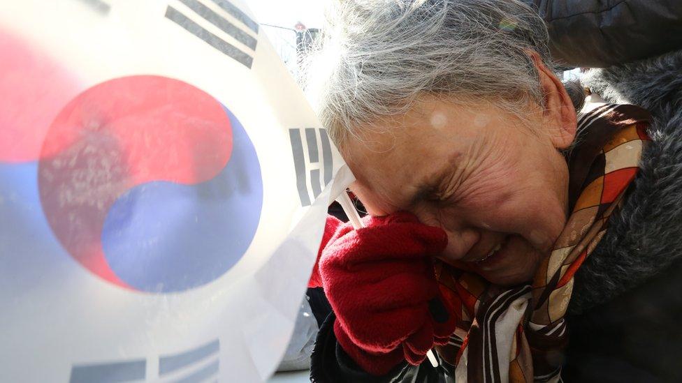 A supporter of impeached South Korean President Park Geun-hye, reacts after the court's ruling on the impeachment of South Korean President Park Geun-hye near the Constitutional Court in Seoul, South Korea, 10 March 2017