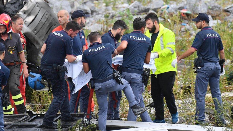 Rescuers pull survivors of the Genoa bridge collapse from the debris