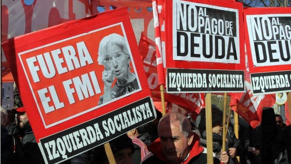 People protest during a demonstration against the International Monetary Fund, in Buenos Aires, Argentina, 21 July 2018.