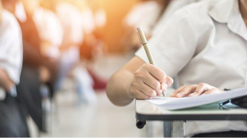 A school child with pencil and notebook