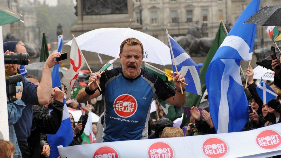 Eddie Izzard reaches the finish line after completing his 1,100mile run around the UK, in support of Sport Relief.