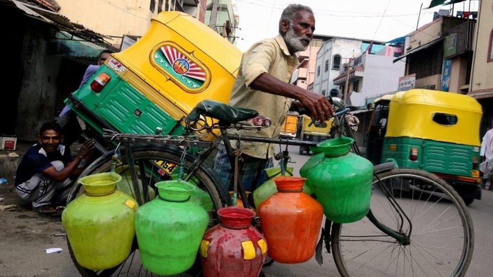 A man with water carriers in Bangalore (13 April 2016)