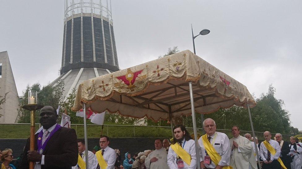 people parade outside Metropolitan Cathedral