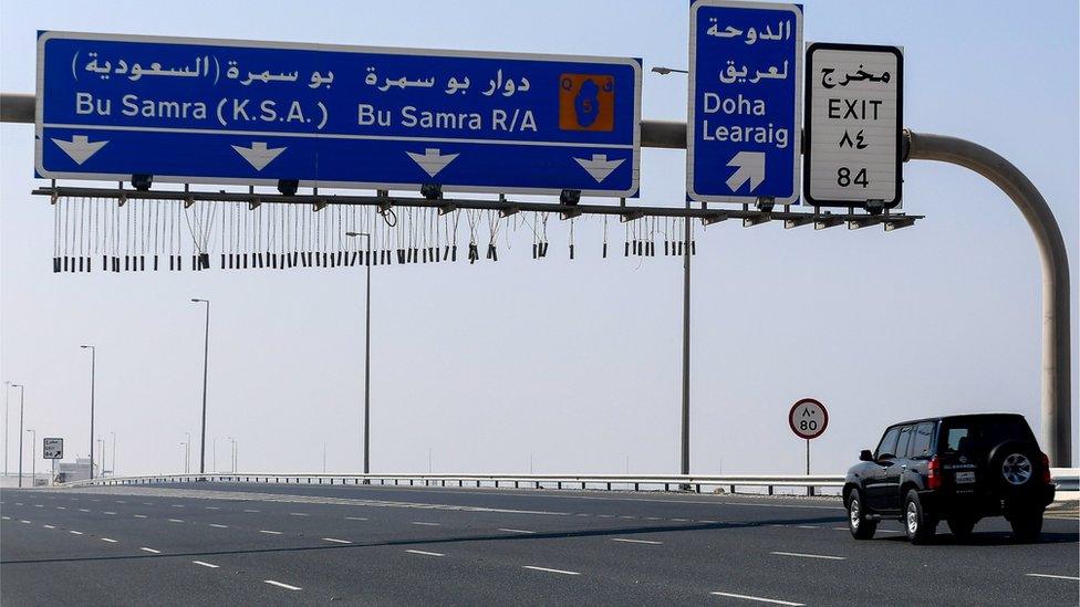 Vehicles drive on road leading to Qatar's land border crossing with Saudi Arabia at Abu Samrah (6 January 2021)