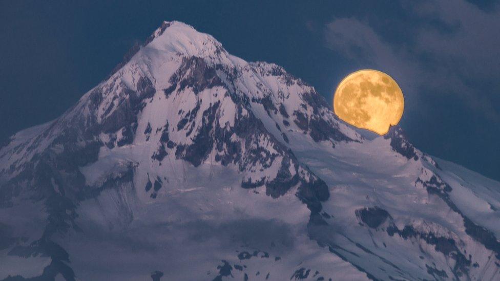 moon-rising-near-mountain