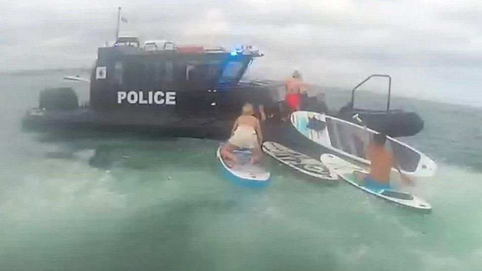 Paddleboarders picked up by police