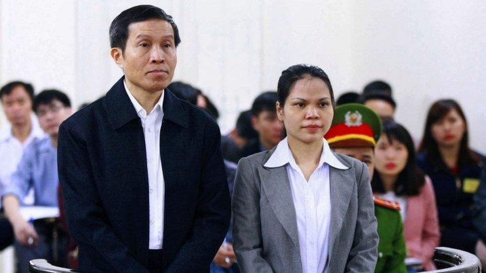 Vietnamese blogger Nguyen Huu Vinh (L), 60, and his assistant Nguyen Thi Minh Thuy (R), 35, stand trial in a court room at the local People"s Court in Hanoi on March 23, 2016.