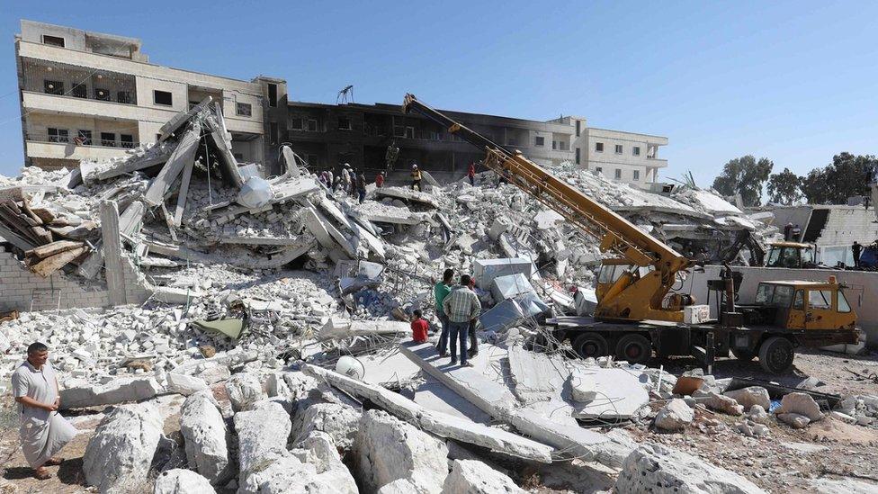 Buildings destroyed by an explosion at an arms depot in Sarmada, Idlib province, Syria (13 August 2018)