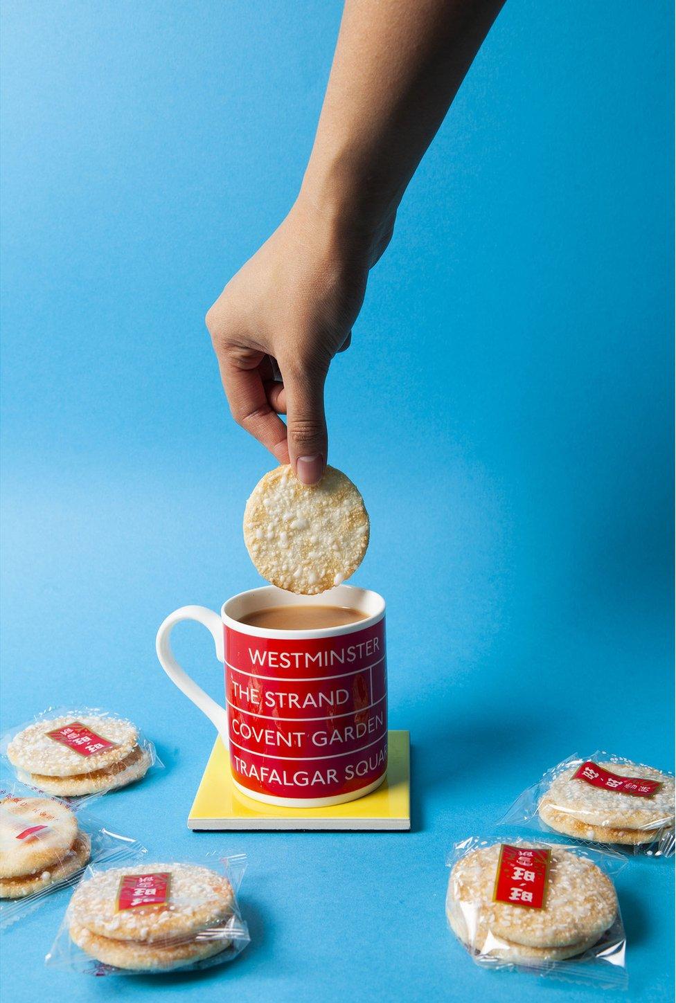 International biscuits being dunked into tea