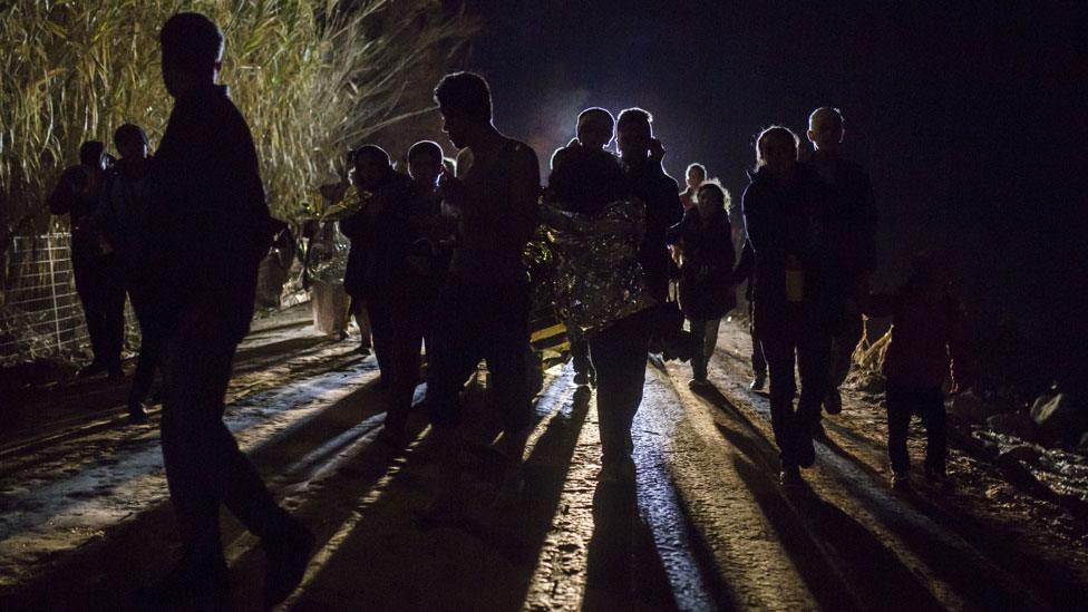 Migrants arrive in Greece after crossing the sea on a dinghy