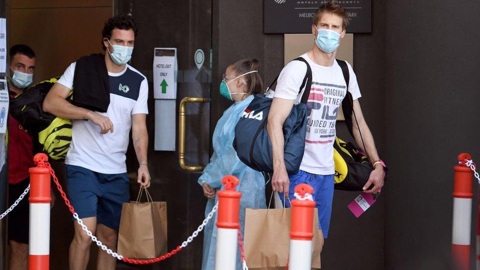 tennis players leaving hotel