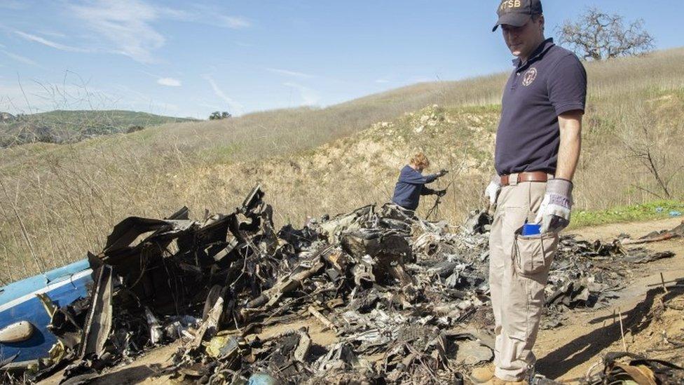 Investigators work at the scene of the helicopter crash that killed former NBA star Kobe Bryant