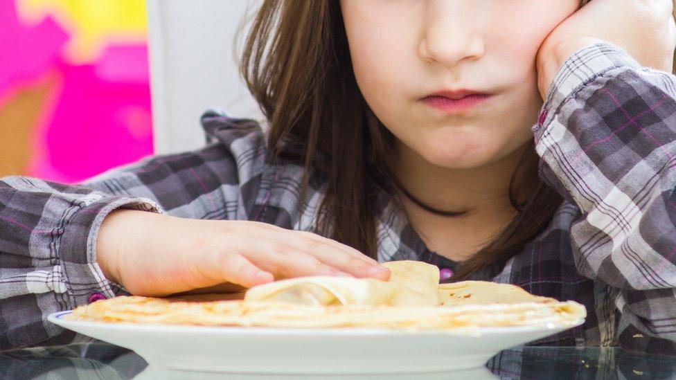 Girl looking at food