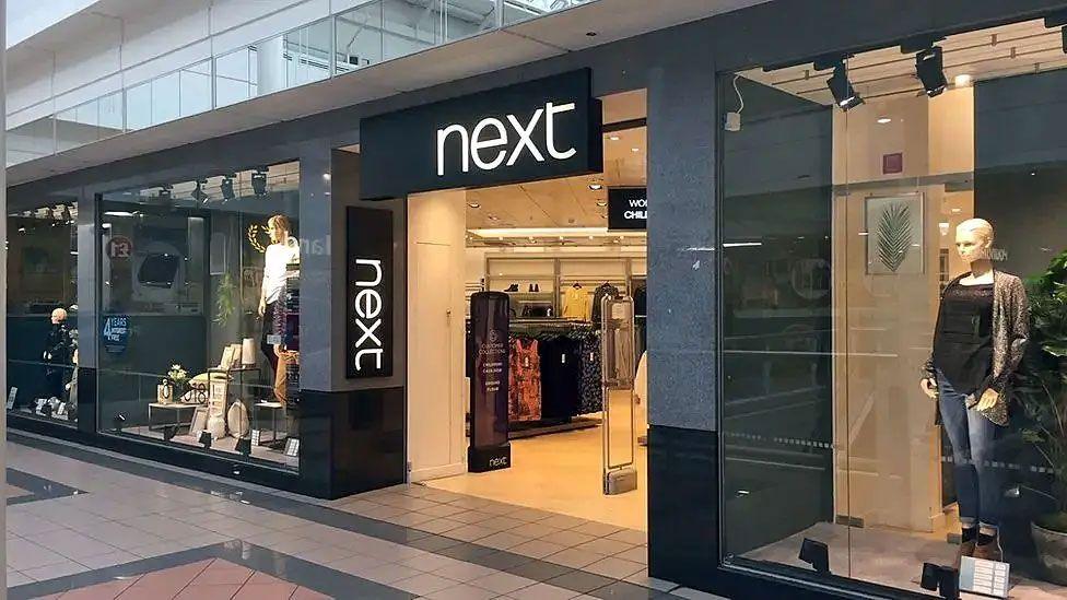 A Next retail outlet in Dumfries with clothing in the window