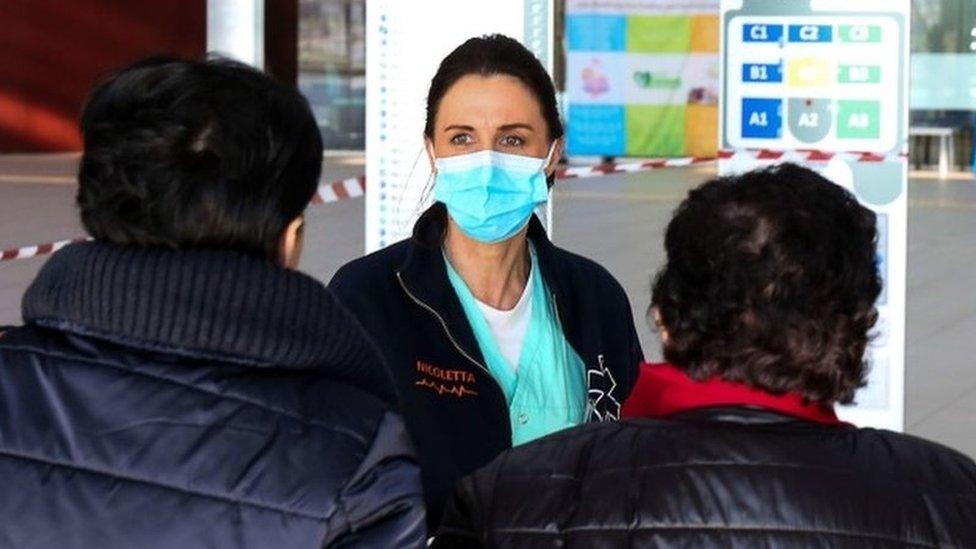 Healthcare professionals at work at the hospital of Schiavonia, northern Italy, 8 March 2020