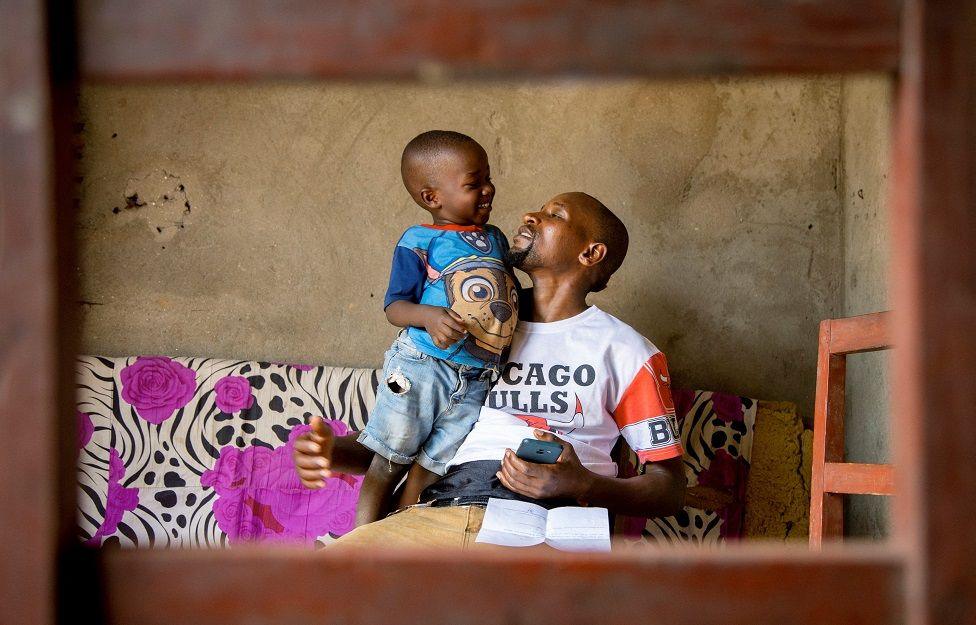 A 35-year-old man and his son in Bujumbura, Burundi - Tuesday 1 October 2024