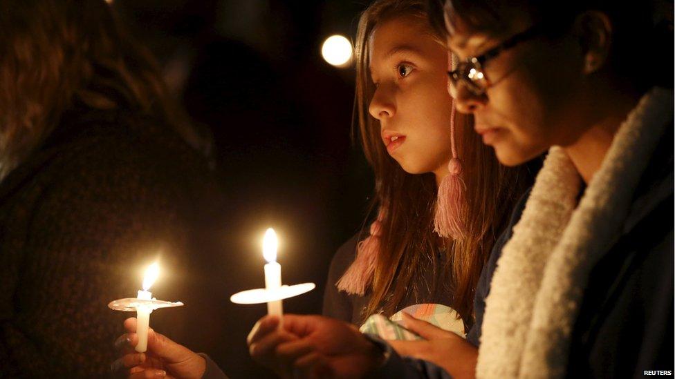 Attendees reflect on the tragedy of Wednesday"s attack during a candlelight vigil in San Bernardino, California December 3, 2015.