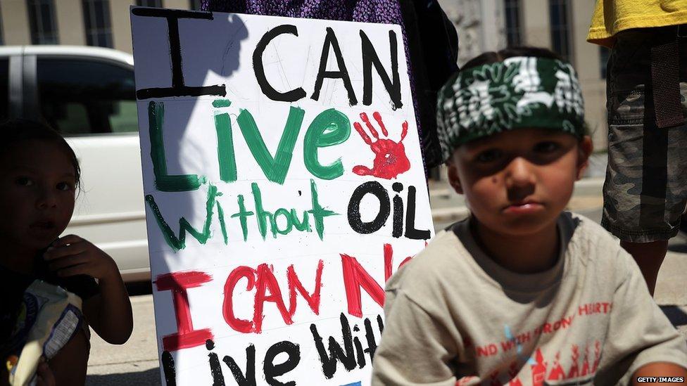 Little boy protesting the development of the Dakota Access pipeline.