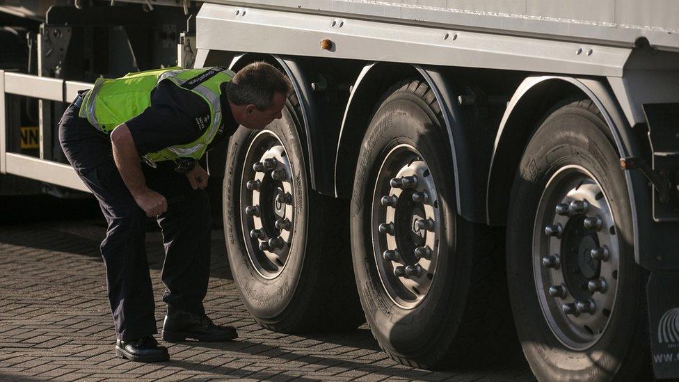 UK Border Force officer checking a lorry